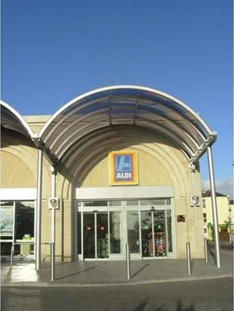 Curved Grey Polycarbonate Entrance Feature Supermarket Plymouth